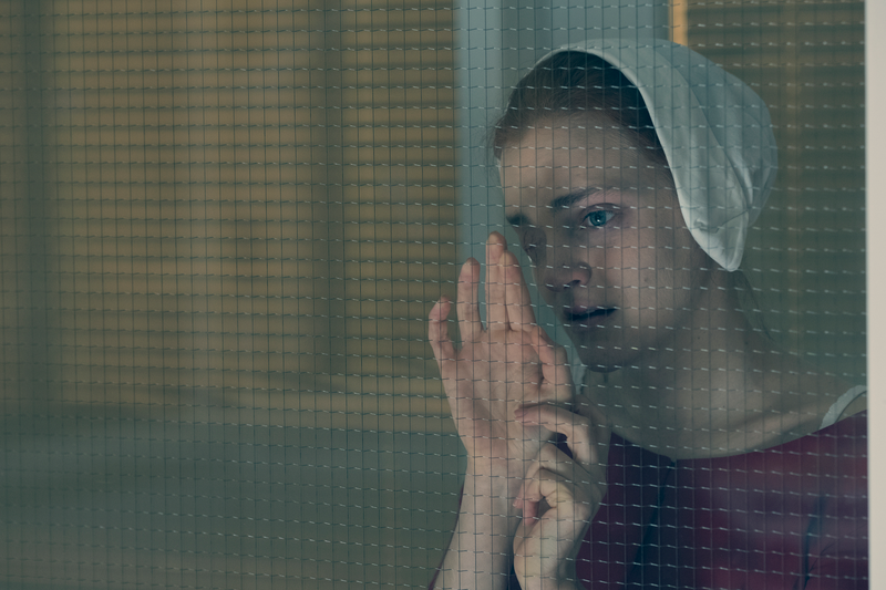 Janine (Madeline Brewer) watches her child.